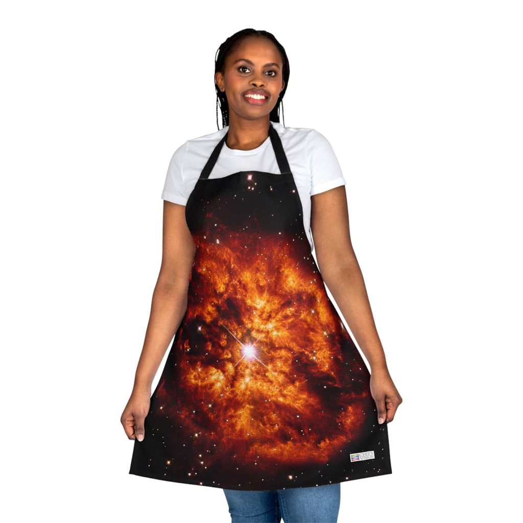 A woman wearing a Chef's Vision Cosmos Apron adorned with a captivating image of a nebula, bringing the mystical beauty of the cosmos into her kitchen.