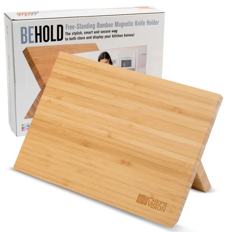 Two Chef’s Vision BEHOLD Magnetic Kitchen Knife Blocks—one black, one bamboo—are displayed with their boxes, offering a stylish and practical solution for organizing your kitchen knives.
