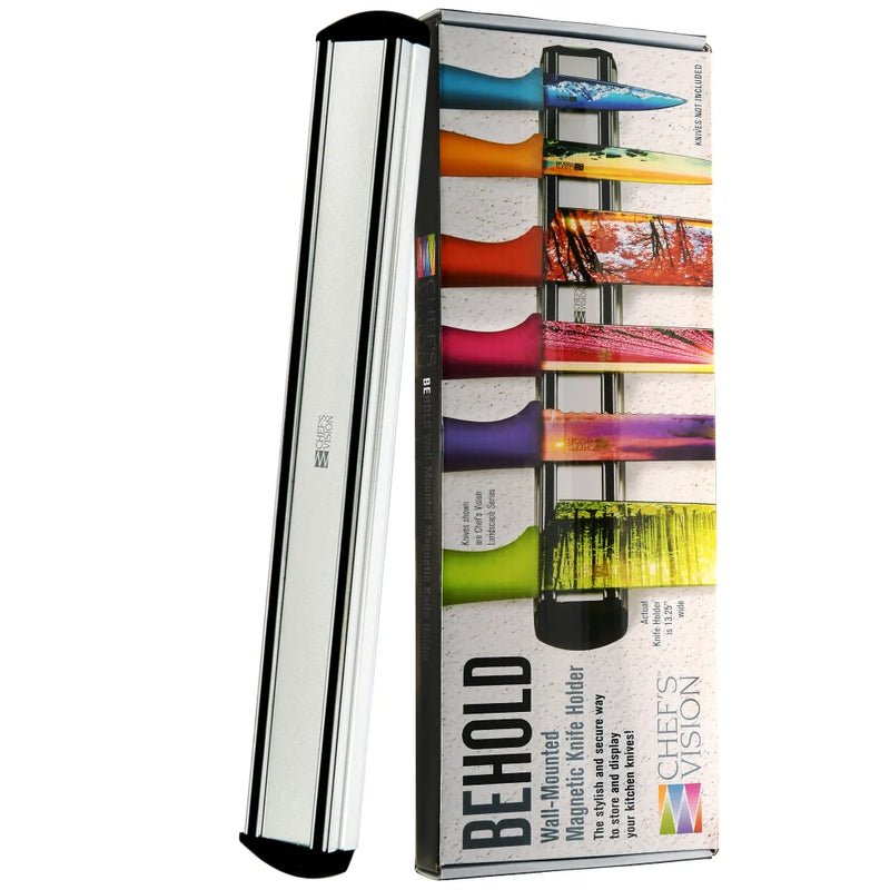 The BEHOLD Wall-Mounted Magnetic Knife Holders by Chef's Vision are shown in stainless steel next to vibrant packaging featuring knives with paint-like blade colors—a stylish, modern magnetic storage solution.