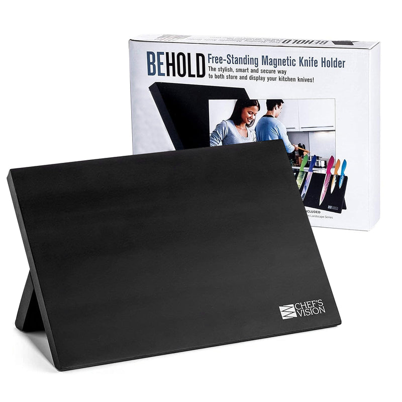 The BEHOLD Magnetic Kitchen Knife Block by Chef's Vision is a chic and practical addition to your kitchen, boasting a free-standing design with a sleek black finish. It's showcased with packaging that includes an image of two people using the product, providing a contemporary solution for knife storage that enhances your kitchen decor.