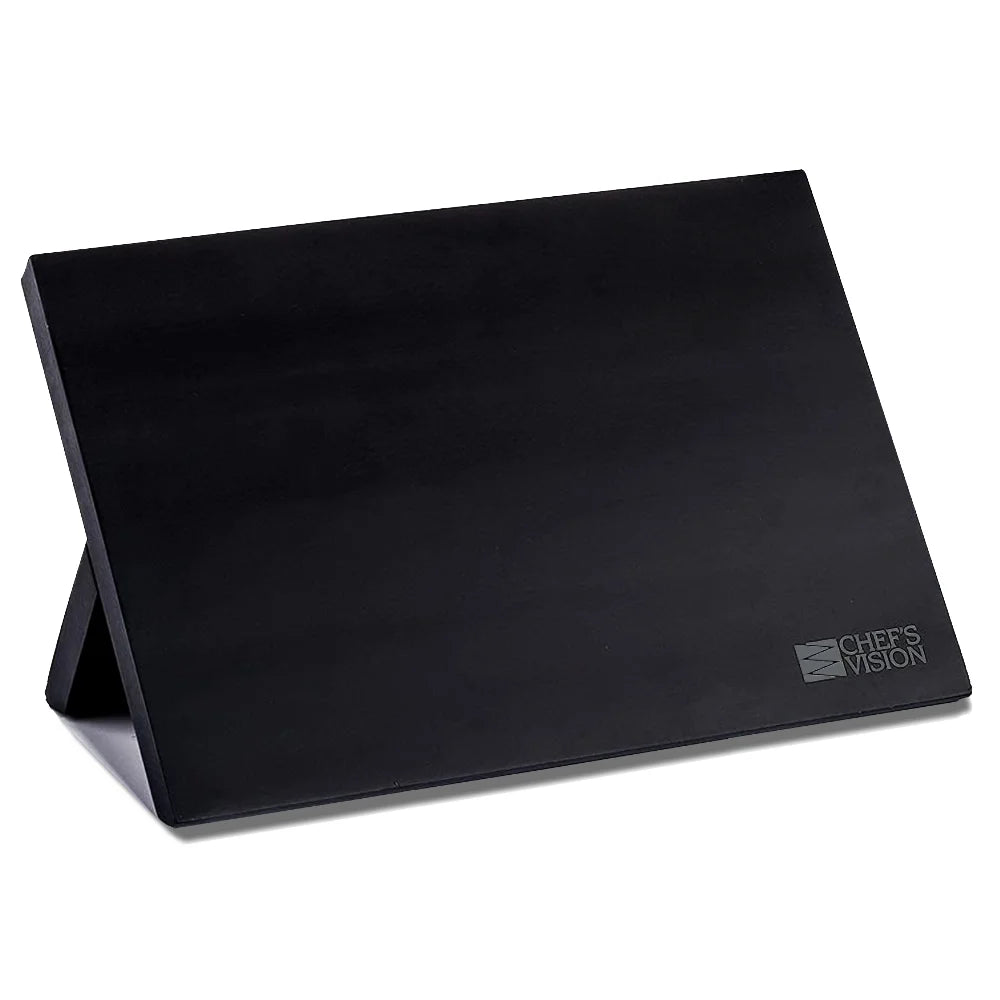 The BEHOLD Magnetic Kitchen Knife Block by Chef’s Vision is a sleek black, angled organizer and storage solution featuring the Chef’s Vision logo in the bottom right corner.