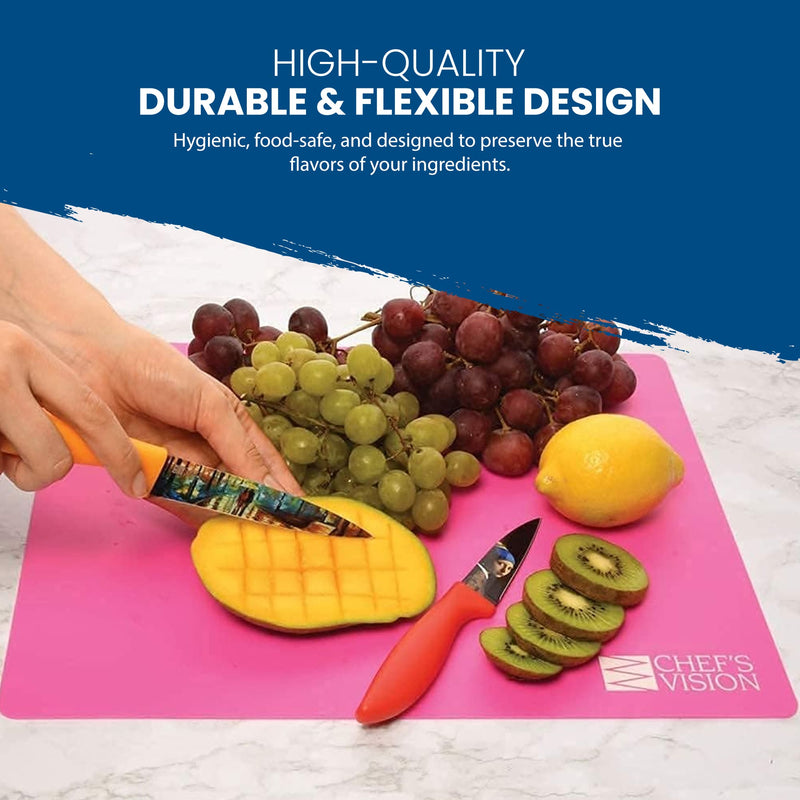 A person slices a mango on a pink cutting mat from the Slice Bright Flexible Cutting Mats - Set of 6 by Chef's Vision, surrounded by grapes, a lemon, and kiwi slices. Text highlights the high-quality, durable, and flexible design of these BPA-free, anti-bacterial cutting mats.