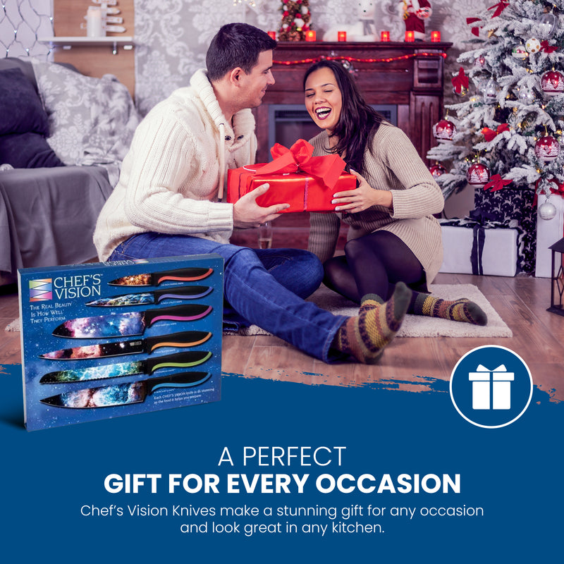 A man and woman sit by the Christmas tree and fireplace exchanging gifts, with the Chef's Vision Cosmos Six-Piece Knife Set displayed in the foreground.