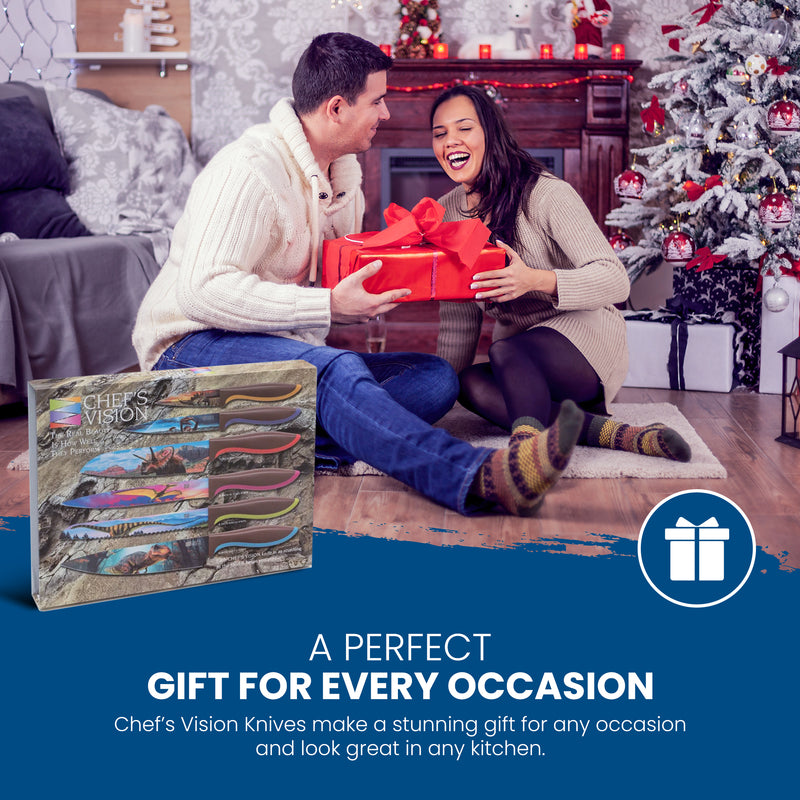 A man and woman sit on the floor by a Christmas tree, smiling as the man gives the woman a wrapped gift; in the foreground is the Chef's Vision Jurassic Six-Piece Knife Set.