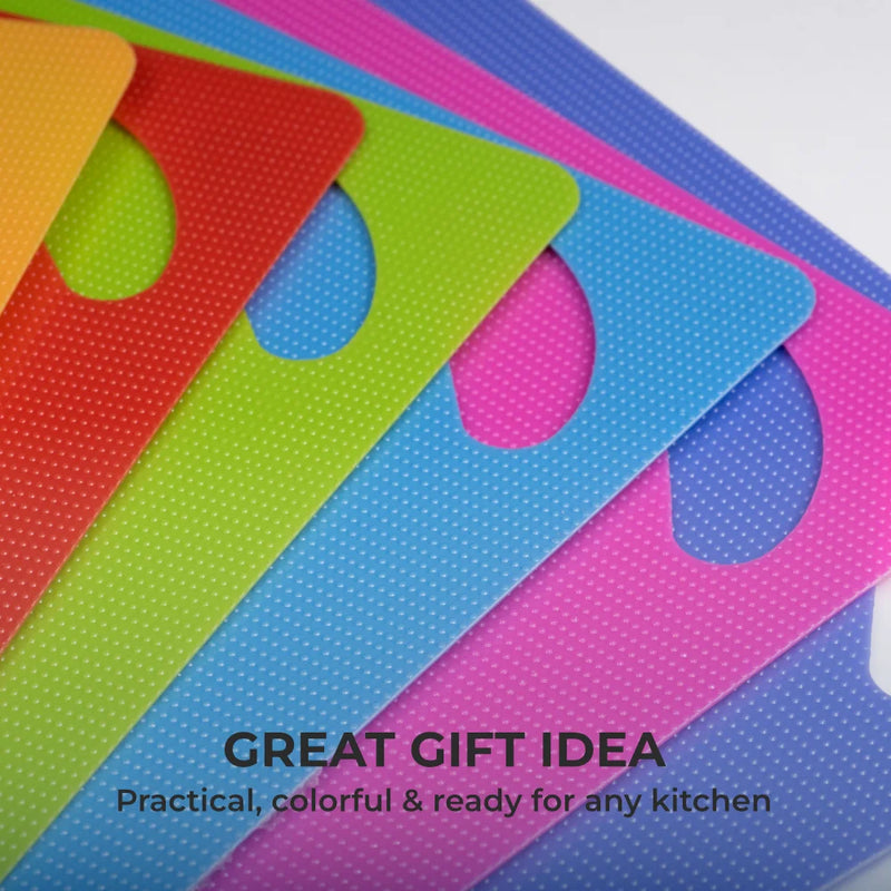Six vibrant, BPA-free Chef's Vision Slice Bright Flexible Cutting Mats are spread on a white background with the caption: "Great Gift Idea: Practical, colorful & perfect for every kitchen.