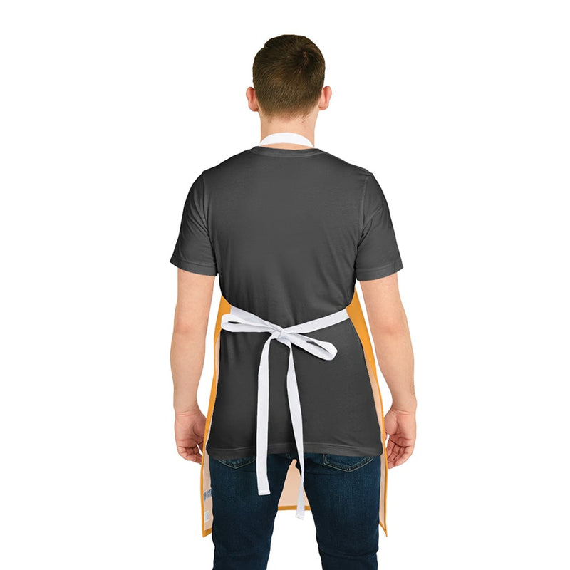 The vibrant back view of a man wearing a Chef's Vision color-themed apron from his collection.