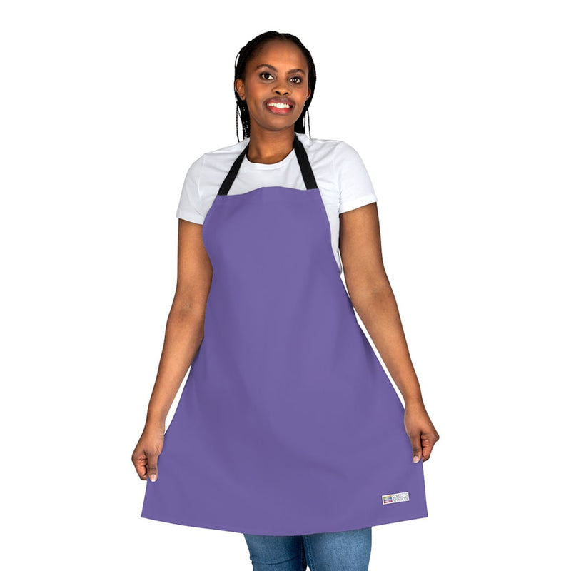 A woman wearing a Chef's Vision apron.