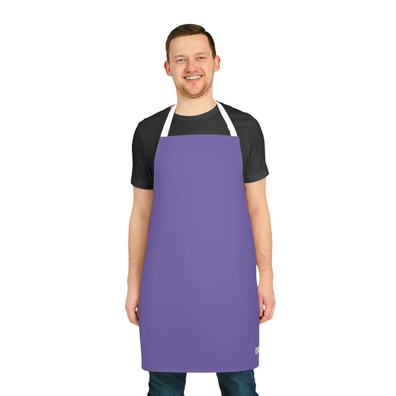 A man wearing a vibrant purple Chef's Vision Color Apron.