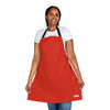 A vibrant woman wearing a Chef's Vision Color Apron.