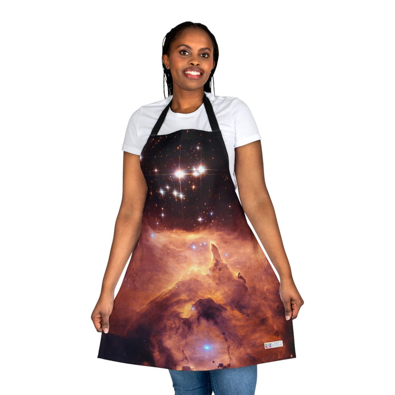 A woman wearing a Chef's Vision Cosmos Apron in the kitchen.