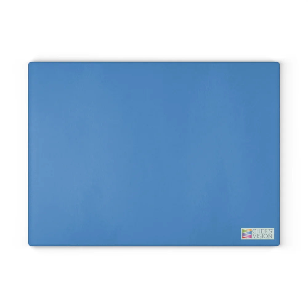 The Chef's Vision SliceBright Color Glass Cutting Board is a rectangular blue board with a small logo in the bottom right, ideal for kitchen counters and shown on a white background.
