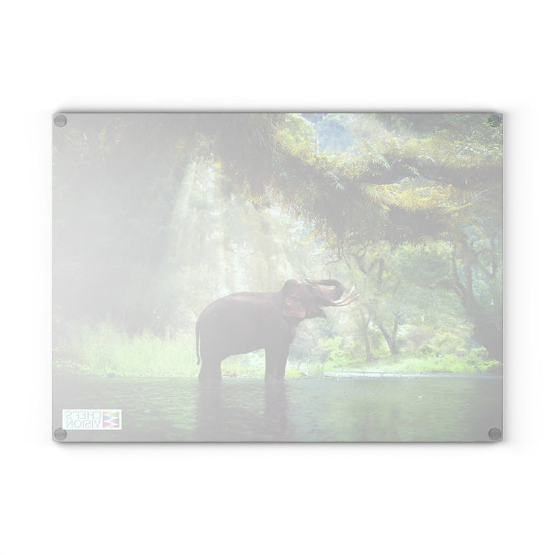 A photo of a Chef's Vision SliceBright Wildlife Glass Cutting Board featuring an elephant standing in the water.