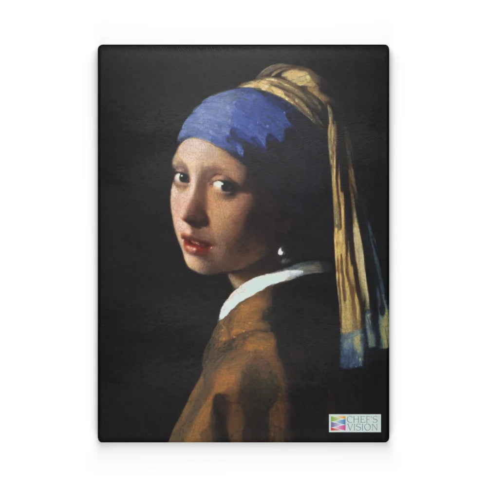 A woman with a blue and yellow headscarf and pearl earring looks over her shoulder against a dark background, featured on the SliceBright Masterpiece Glass Cutting Board by Chef's Vision, with a discreet logo in the corner.