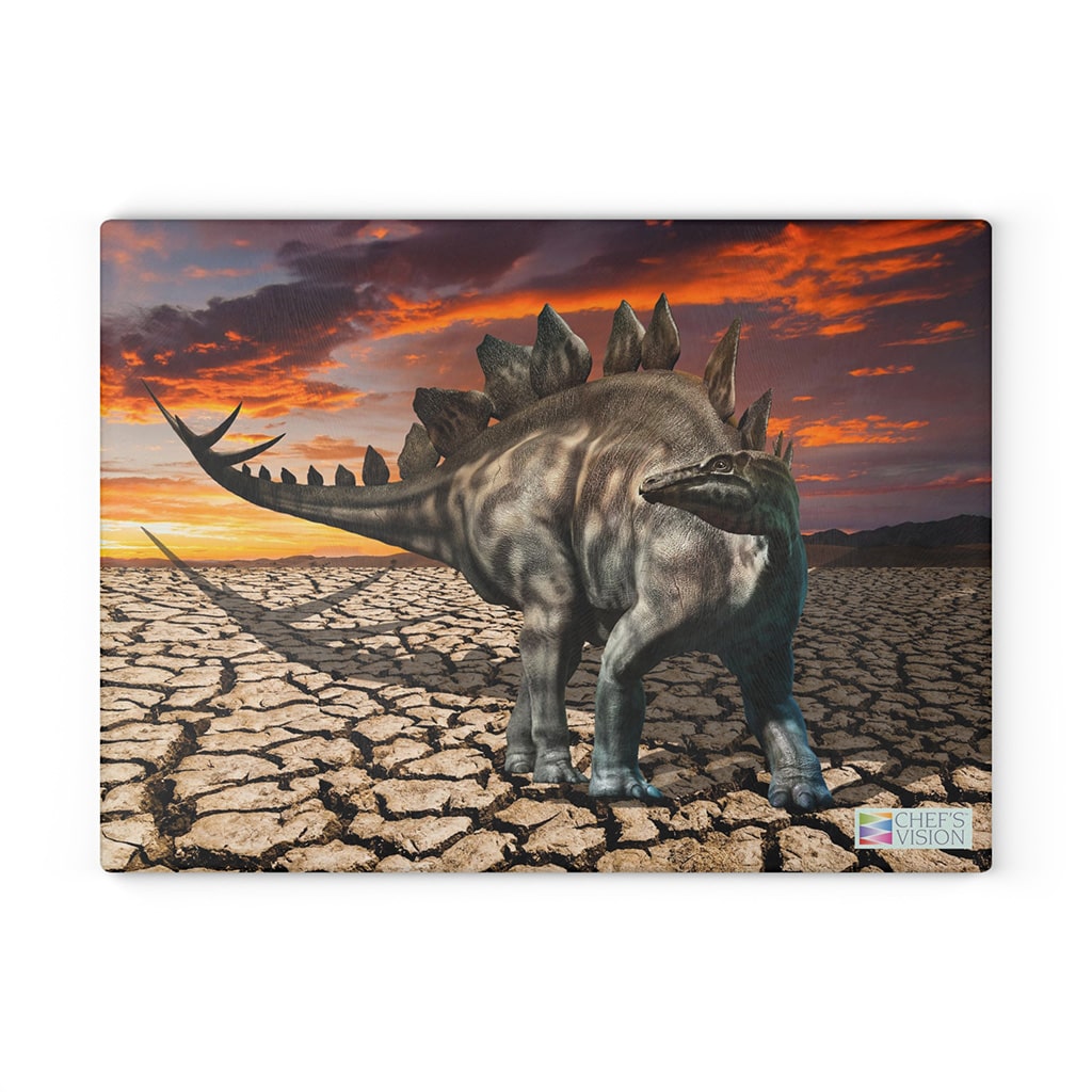 An image of a dinosaur in a dry desert from the Chef's Vision SliceBright Jurassic Glass Cutting Board.