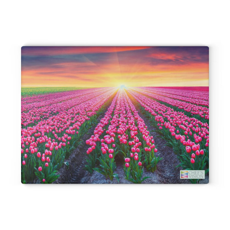 Chef's Vision SliceBright Landscape Glass Cutting Board features scenic pink tulips beneath a vibrant sunset, bringing striking floral beauty to your kitchen counter.
