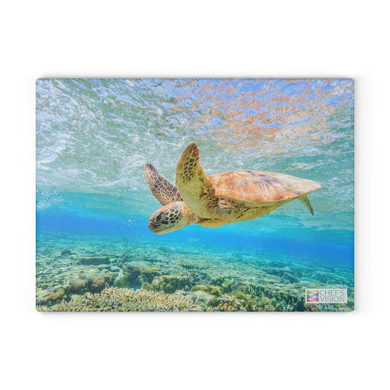 A sea turtle swimming in the ocean on a Chef's Vision SliceBright Wildlife Glass Cutting Board.