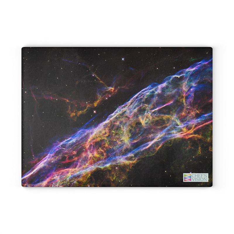 A SliceBright Cosmos Glass Cutting Board by Chef's Vision themed image of the nebula on a canvas.
