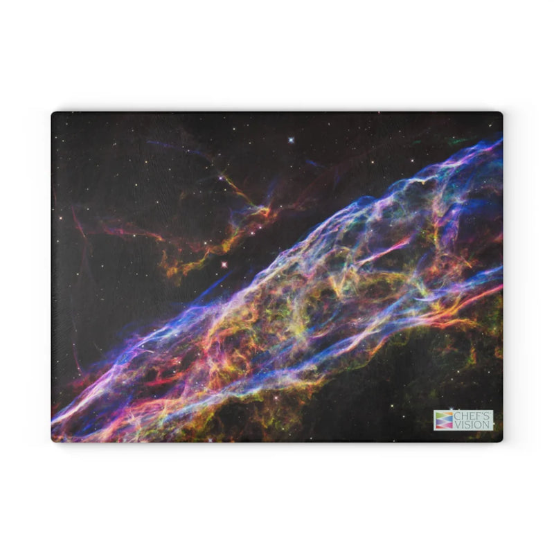 The SliceBright Cosmos Glass Cutting Board by Chef's Vision features a vivid nebula against a dark backdrop and a discreet logo, bringing stunning cosmic imagery to your kitchen counter.