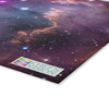 A cosmos-themed image of a galaxy on a SliceBright Cosmos Glass Cutting Board, displayed on a Chef's Vision glass cutting board.
