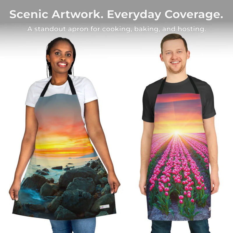 Two people wear Chef's Vision Landscape Aprons—one shows a rocky beach sunset, the other tulips beneath a colorful sky. Above, text highlights these artistic, practical aprons featuring stunning nature-inspired artwork.