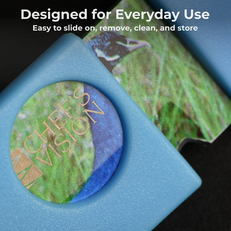 Close-up of a Chef's Vision Wildlife Series knife with a BladeKeepers Blade Cover in blue, partially shielding the vibrant blade. Text above: "Designed for Everyday Use – Easy to slide on, remove, clean, and store.