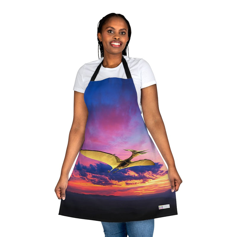 A woman wearing a Chef's Vision Jurassic Apron with an image of a dinosaur flying in the sky, making it a unique gift for dinosaur enthusiasts.
