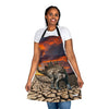 A woman wearing a Chef's Vision apron with an image of a dinosaur in the desert.
