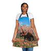A woman wearing a Chef's Vision apron with an image of a triceratops.