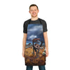 A man wearing a Chef's Vision Jurassic Apron with a dinosaur on it.