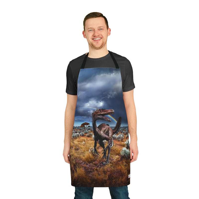 A man wearing a Chef's Vision Jurassic Apron with a dinosaur on it.