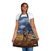 A woman wearing a Chef's Vision apron with a dinosaur on it.