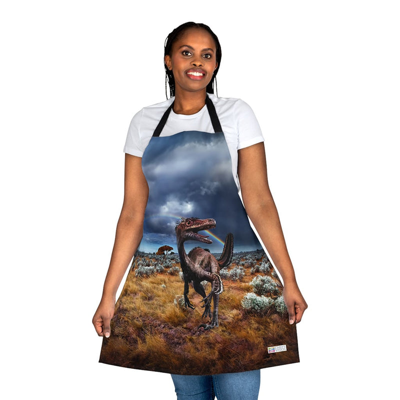 A woman wearing a Chef's Vision apron with a dinosaur on it.