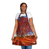A woman wearing a red Landscape apron with a tree in the background showcasing nature's beauty.
