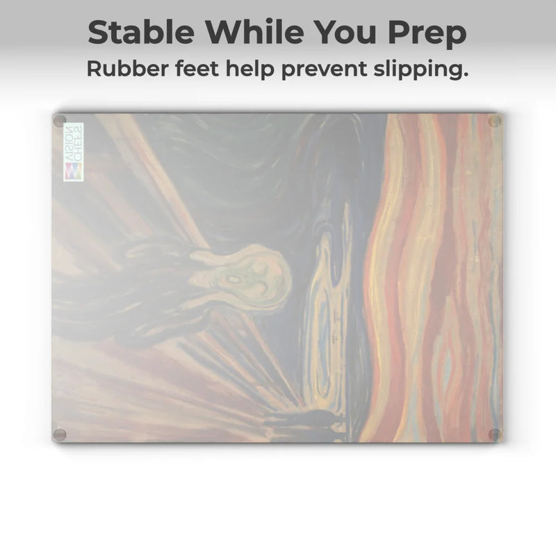 The Chef's Vision SliceBright Masterpiece Glass Cutting Board, featuring "The Scream" artwork and rubber feet on each corner, stays stable while you prep, helping prevent slipping on your kitchen counter.