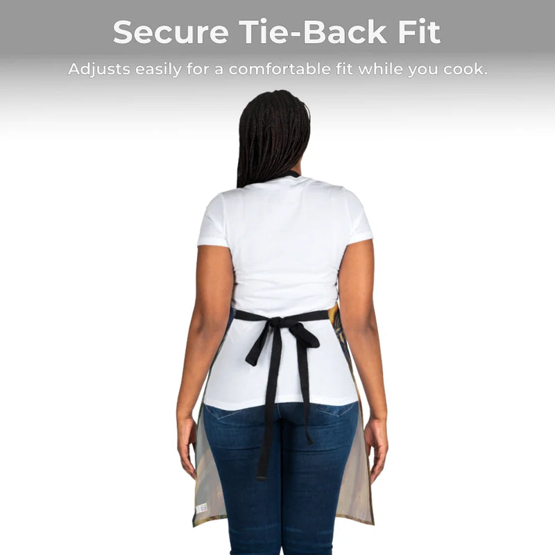 A person seen from behind wears a white shirt, blue jeans, and a Chef's Vision Masterpiece Apron made of durable polyester with black adjustable tie-back straps. Above them, text highlights the customizable fit.