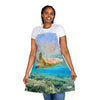 A woman wearing a Chef's Vision Wildlife Apron with a turtle swimming in the ocean.