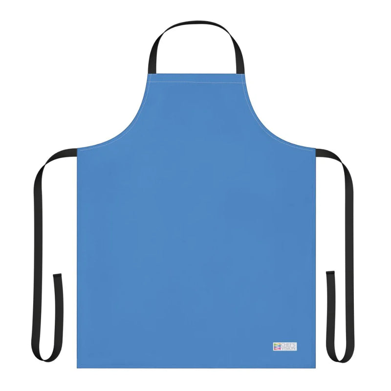 The Chef's Vision Color Apron in plain blue features black neck and waist straps, a small white label at the bottom right, and is displayed on a white background—making it a stylish choice for kitchens or as a thoughtful chef gift.