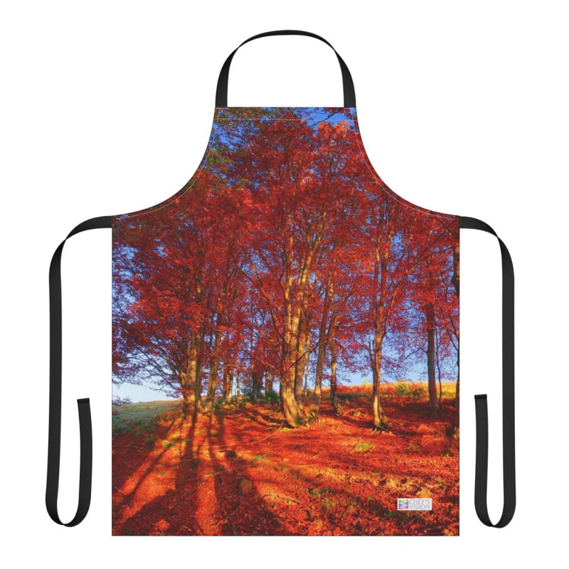 The Chef's Vision Landscape Apron displays a vivid autumn forest with tall trees and red foliage under a clear blue sky, printed on durable polyester canvas.