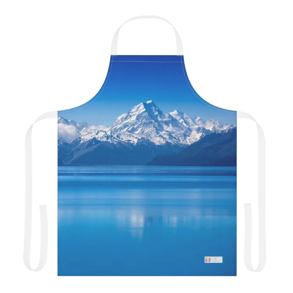 The Chef's Vision Landscape Apron showcases snow-covered mountains mirrored in a blue lake on durable polyester canvas—ideal for fans of nature-inspired artwork and scenic aprons.