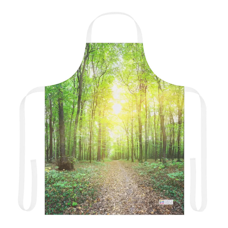 The Chef's Vision Landscape Apron features nature-inspired art of a sunlit forest path with lush green trees, crafted from durable polyester canvas.