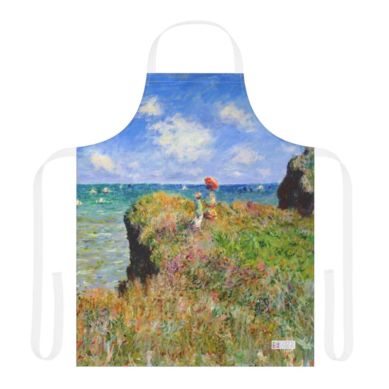The Chef's Vision Masterpiece Apron showcases printed artwork of two figures on a grassy cliff, gazing at the sea beneath a partly cloudy sky.