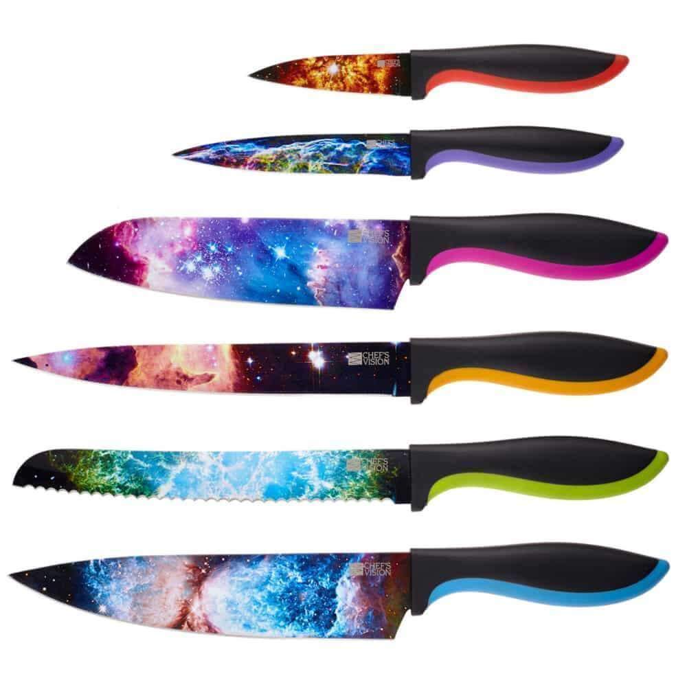 The Chef's Vision Cosmos Six-Piece Knife Set features stainless steel, dishwasher-safe knives with black handles and vibrant galaxy-themed non-stick blades, all arranged in a striking row.
