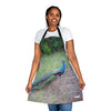 A woman wearing a Chef's Vision apron with a peacock on it.