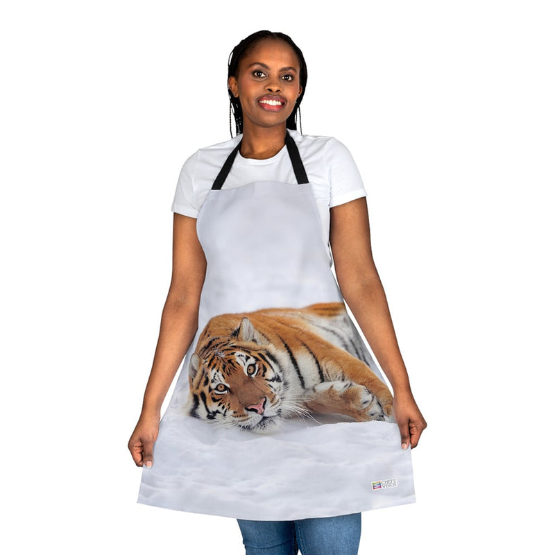 A woman wearing a Chef's Vision apron with a tiger on it.